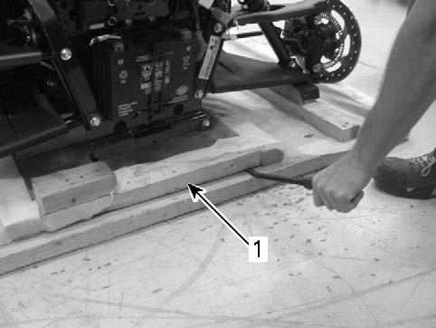 UNCRATING NOTE: The steps that follow describe two methods for lifting the front of the vehicle from the crate base.