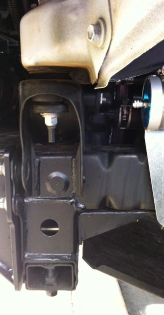 require that the solenoid be mounted either behind the grill on the center support or in the engine bay.