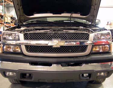 Remove two wire connectors from fog lamps, if equipped. b. Remove six clips and grill from core support and front fenders. Connector d.
