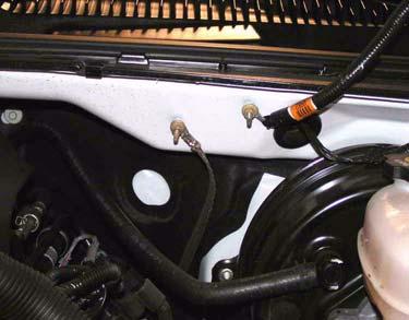 Remove two bolts, two panel clips, and transmission cooler from