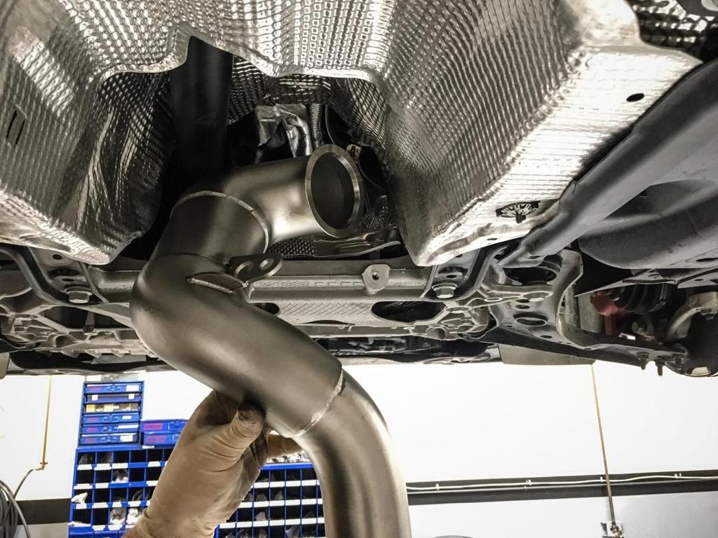 replace it. Install the 034Motorsport Cast Downpipe.
