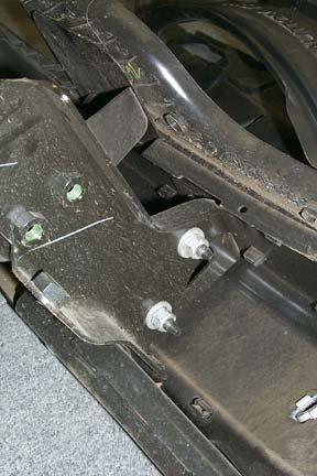 Loosen, but DO NOT REMOVE, cab mounting bolts
