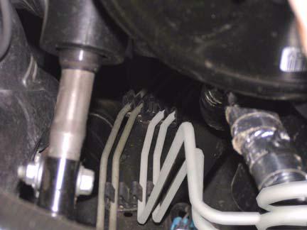 Remove wire harness from wire clip on driver side. Wire clip Pop-up Clips 7.