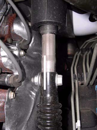 8. Remove wire harness from three clips near brake lines on driver side. b. Mark upper shaft in relation to lower shaft as shown. Clip Steering Shaft Mark Steering Shaft 9.