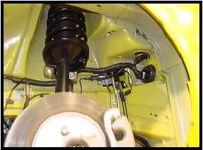 Refer to Figure 16. Figure 16 25. Use side cutter pliers to cut the end off the spare nipple on the wiring harness grommet located at the rear of the wheel well.