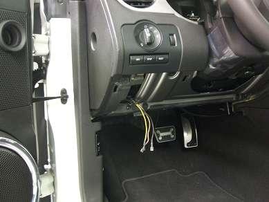 Figure 21 32. Return the steering column lower cover to the vehicle.
