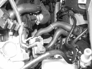 () Hose section of heat exchanger inlet () Engine outlet hose