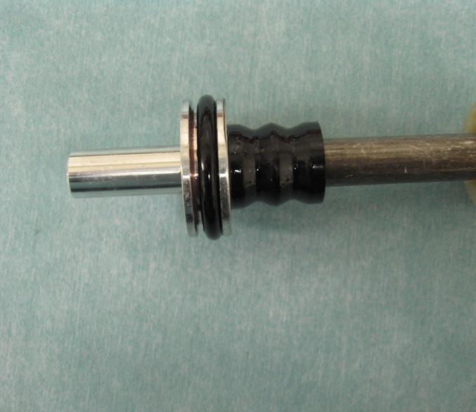3) Replace the air piston o-ring on the compression rod assembly. (Fig. 4) FIG.