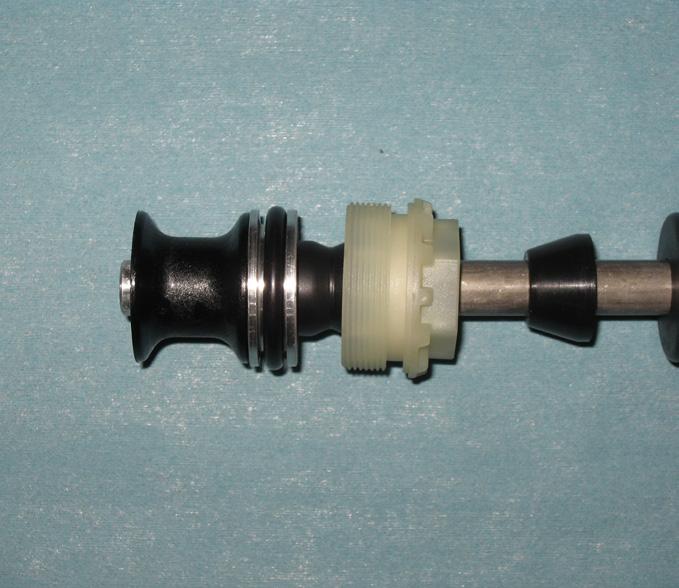 The spacer being on the bottom of the air piston will cause the fork to have 80mm of travel. The spacer being on top of the piston will cause the fork to have 100mm of travel. Fig.