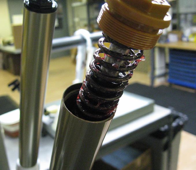 &3) 5 Remove the air piston from the stanchion leg. There are two ways to do this.