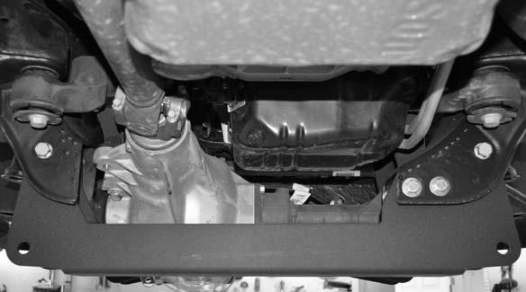 Working on the passenger side, secure the newly installed rear cross member to the passenger side rear lower control arm pocket using the