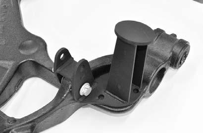 Place the lower shock/bump stop bracket back onto the lower control arm and secure using