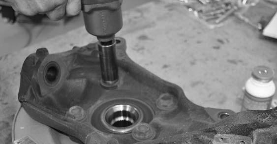 Remove the hub assembly from the knuckle and set aside.