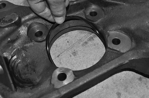 60. Locate the new driver side steering knuckle.