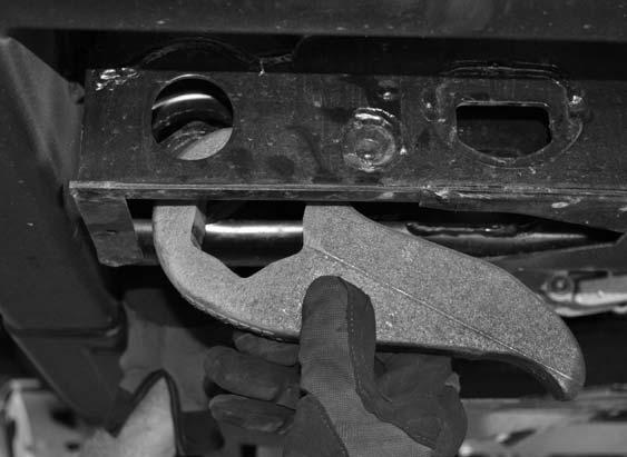 Remove the torsion bar cross member from the vehicle and set aside for later re-installation. 9.