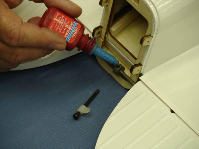Remove the elevator control rod and apply a small drop