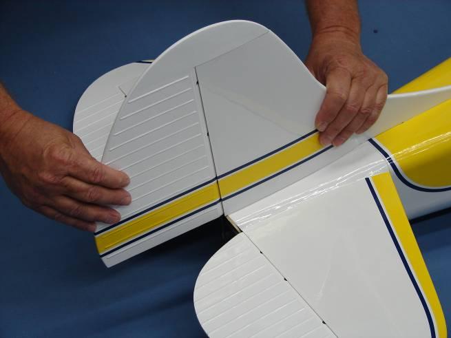 17. Carefully slide the hinges in rudder into each hinge hole and against the trailing edge of the fin.