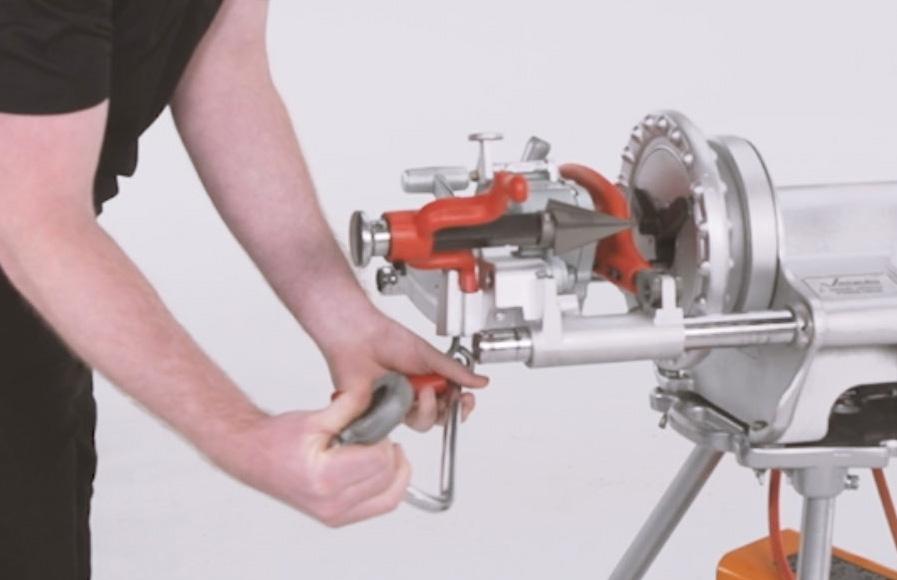 Using proper lifting techniques, lift the tool and carriage assembly