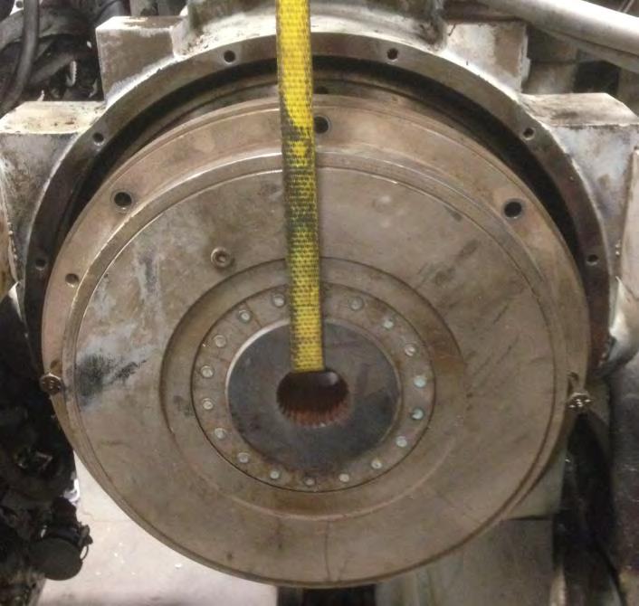 RUN A STRAP THRU THE CENTER OF THE TORSIONAL COUPLING AND ATTACH TO A CRANE WITH