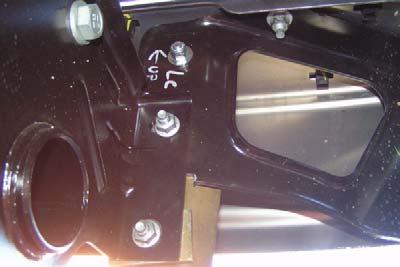 d. Position rear bumper, kit brackets (rear bumper), and kit washers (rectangular) on rear bumper brackets with two double bolt fasteners and four nuts. Do not tighten. e.