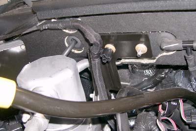 Passenger Side: Remove nut and ground wires from stud on firewall.