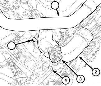 22. Remove the exhaust backpressure sensor tube from the exhaust manifold. On 2007.5-2012 trucks, the tube will run from the manifold to the thermostat housing.