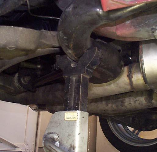 11. Remove the front brake rotor. 12. Detach the ABS sensor from the spindle. 5. Level the car by measuring from the bottom of the rocker panels to the ground.