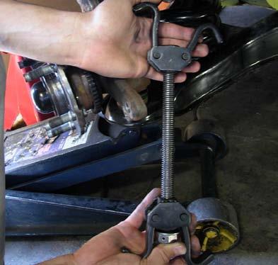 Do this until the ball joint taper comes free from the spindle. 24. Raise the control arm 1/2 with the floor jack.