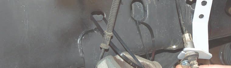 Attach the brake line to the supplied relocation bracket using the supplied 5/16 x 3/4 bolts,