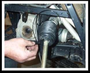 Pull boot back over the ball joint and steering stop and