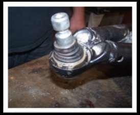 27. Remove the ball joints from the STOCK control arms.