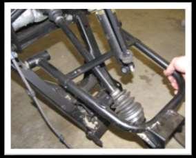 79. Disconnect the rear shock from the upper frame and