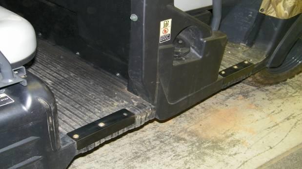 If installing a rear cab, remove the Christmas tree plugs from the rear floor mat on both sides of the vehicle. Install the rear floor plates which are supplied with the rear cab.