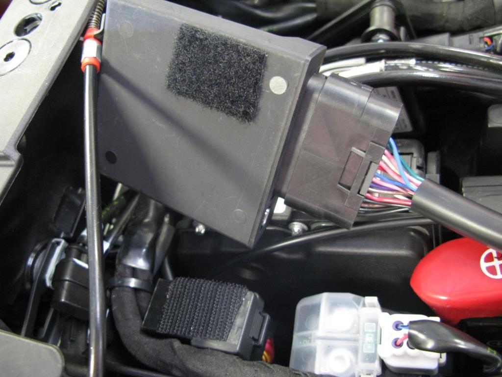 Locate the Gear Position Sensor (GPS) connectors which can be found under the rider seat.