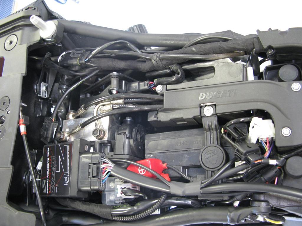 To make accessing the injector connector easier, disconnect the factory harness TPS connector from the right side of the throttle bodies.