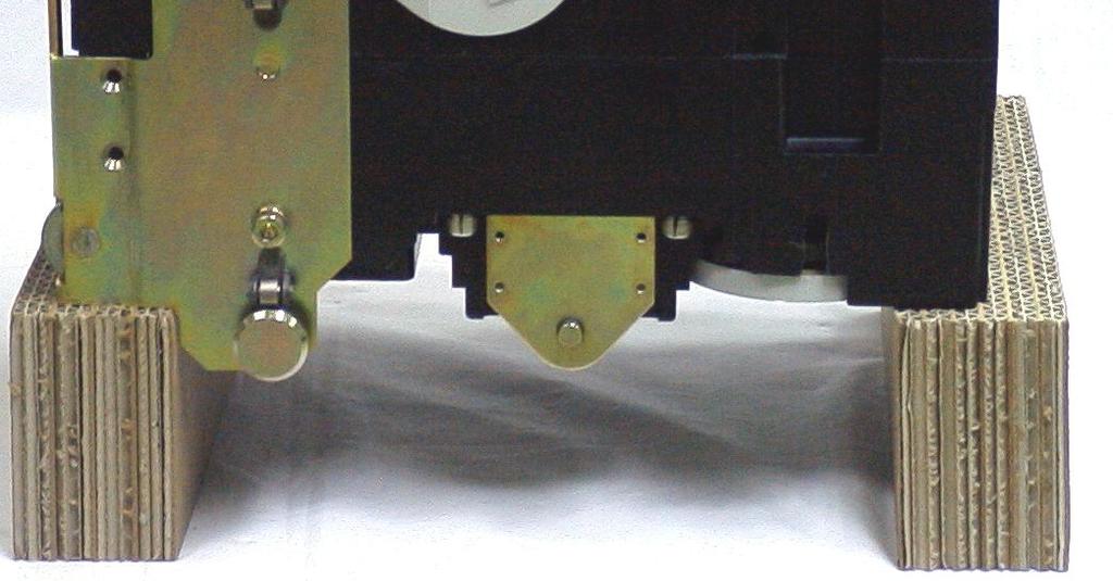 2) Carefully lay the breaker body on spacers with the backside down as shown in Fig. 42.