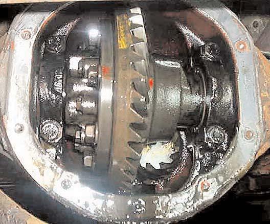 a sufficient length of the splines are sticking up to fully seat and hold the posi, then place the posi unit on the axle with the gear teeth facing down.
