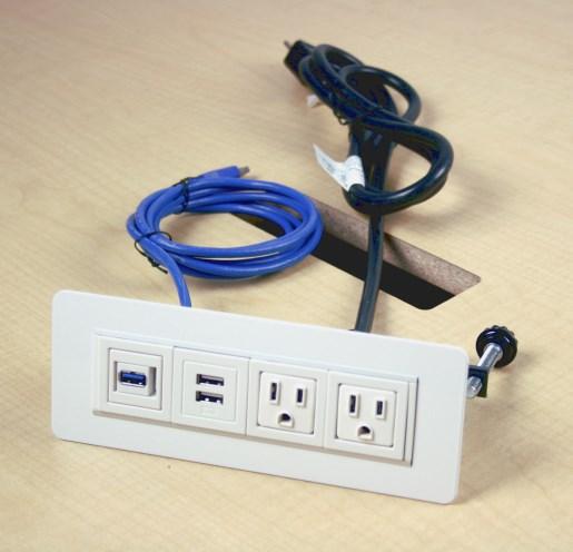 Drop the two attached power cords through the cutouts on top of table.