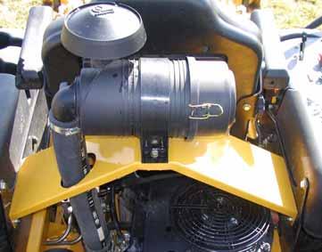A specially designed dry filter is standard equipment on the Hustler Z and Super Z mowers and supplies clean combustion air to the engine "FIG. 7".