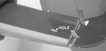 Slide the rudder Z bend into one hole of the servo arm.