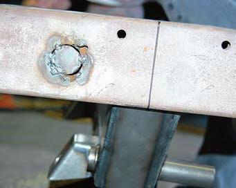 This strengthens the frame at the point where the crossmember will be installed.
