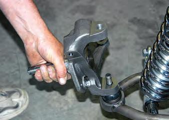 The lower ball joint is long, so spacers are used to make sure the castle nut aligns