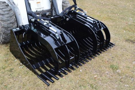 Integrated step in the center of the attachment allows for easy, slip free entry into your skid loader while providing superior hose