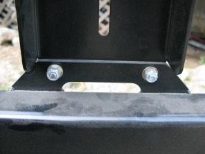 Mount the antenna post to the middle of the tire carrier. Use the back up plate as shown to secure the system in place.