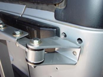 Bolt the upper hinge arm to the tire carrier using 2 @ 3/8 x 1 1/4 bolts with 4 flat washers and 2 locking nuts.