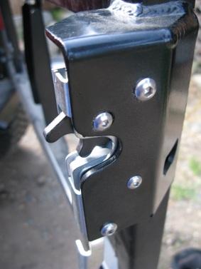 Mount the latch to the tire carrier using 2 @ 1/4 x 1 1/4