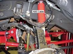 11) If applicable, reconnect the ABS cable. Attach the ABS cable to the knuckle and upper control arm with tie wraps. See illustration #13.