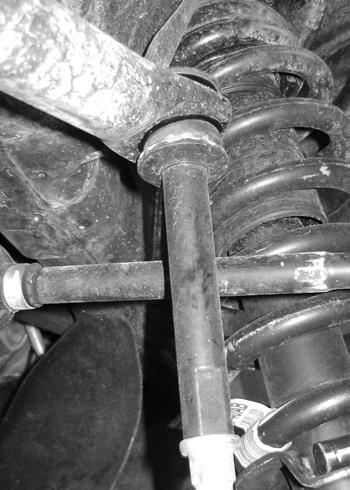 Figure 11 31. Attach the drag link to the new pitman arm with the factory nut. Torque to 55 ft-lbs. 32. Reattach the brakeline to the axle with the factory hardware. Tighten to 25 ft-lbs. 33.