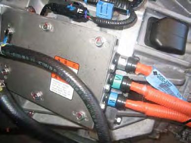 Positive and Negative high voltage power cables are routed from the battery pack, to the Inverter, then