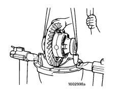 Safely lift the main differential and ring gear assembly from the carrier.
